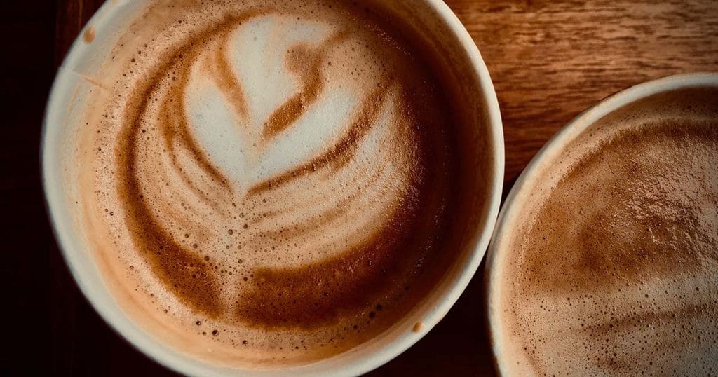Chai Latte served at a coffee shop with custom artwork